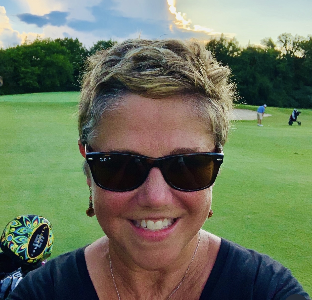 Caroline on the golf course at sunset